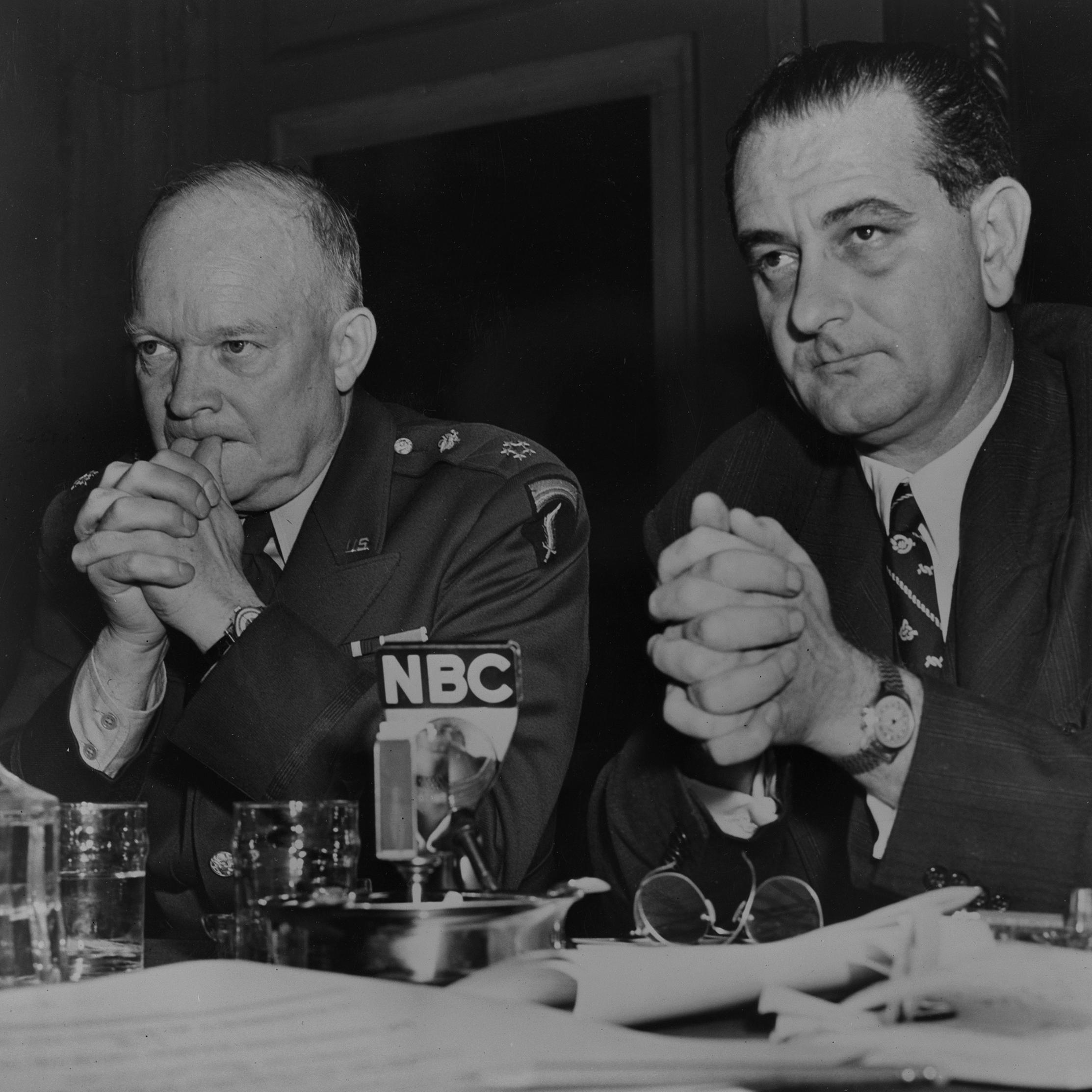 General Dwight D. Eisenhower, in uniform, and LBJ sit behind an NBC microphone at a table.